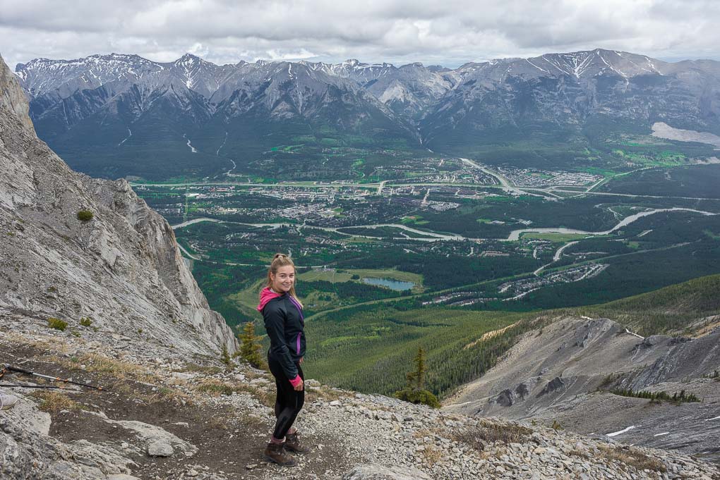 Bailey stands at the top of Ha Ling Peak in Canmore, AB