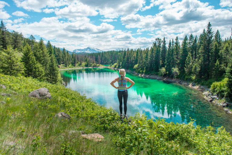 A lady poses for a photo overlooking one of the 5 lakes on the Valley of the Five Lakes hike.