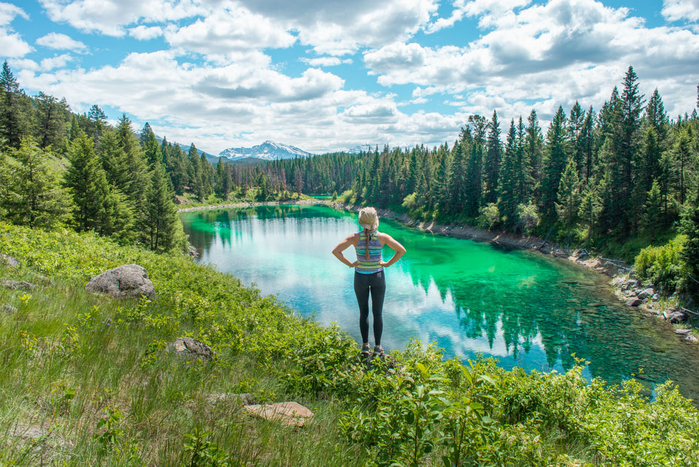 A lady poses for a photo overlooking one of the 5 lakes on the Valley of the Five Lakes hike.