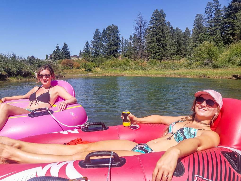 Two girls relax in their floaties while on the Columbia River float