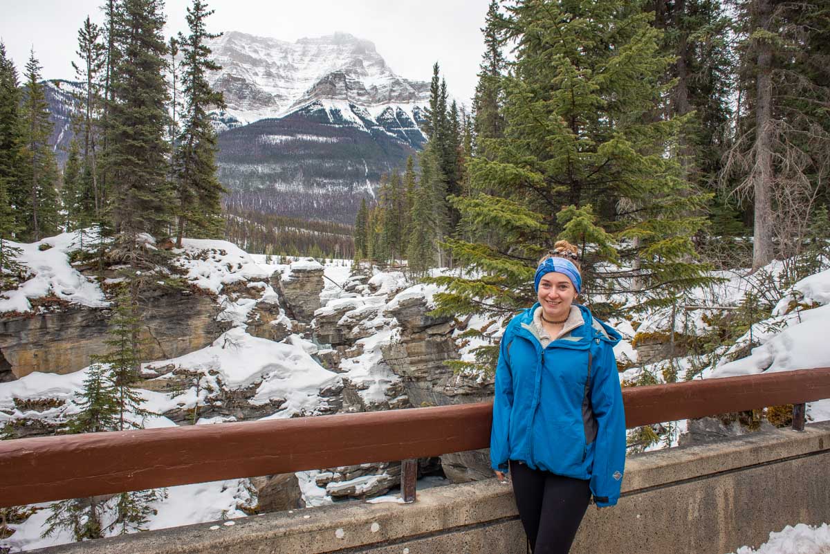 Bailey stands on the bridge over Athabasca Falls in winter