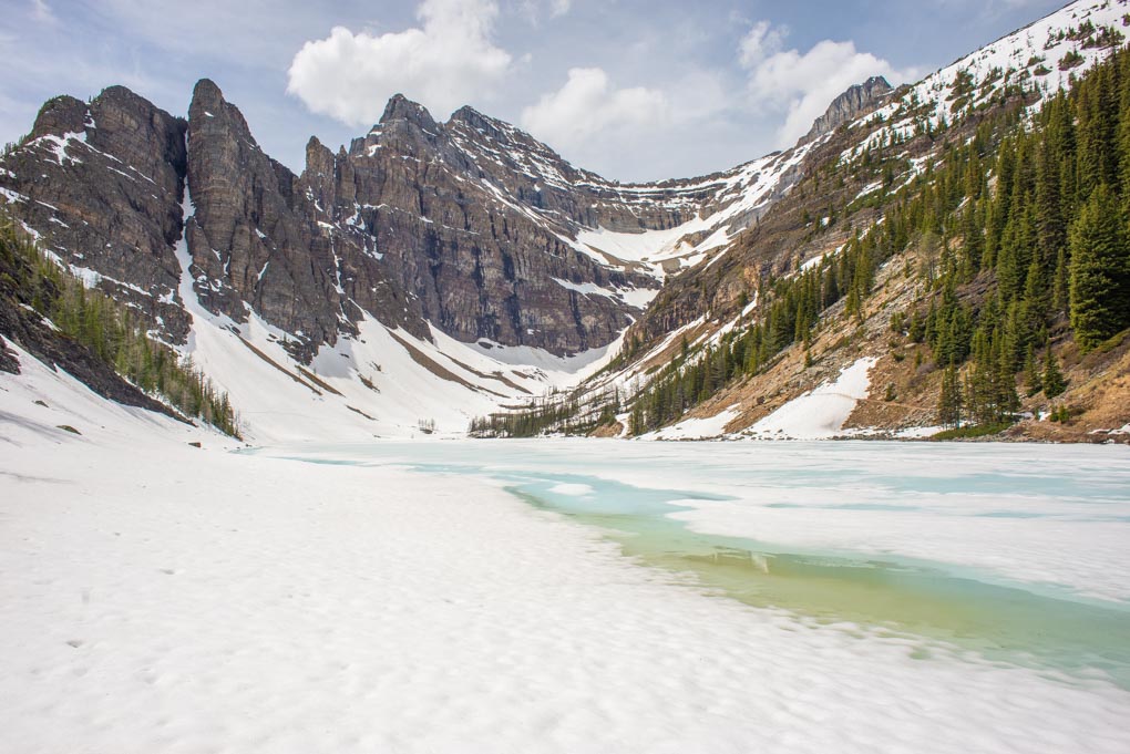 A panoramic view of the ice and snow on the trail that leads past the Lake Agnes Tea house to a viewpoint