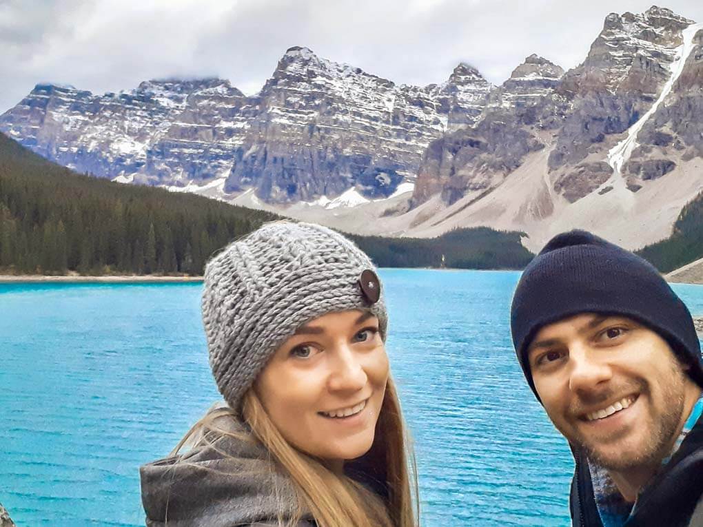 A couple take a selfie at Moraine Lake in Banff National Park