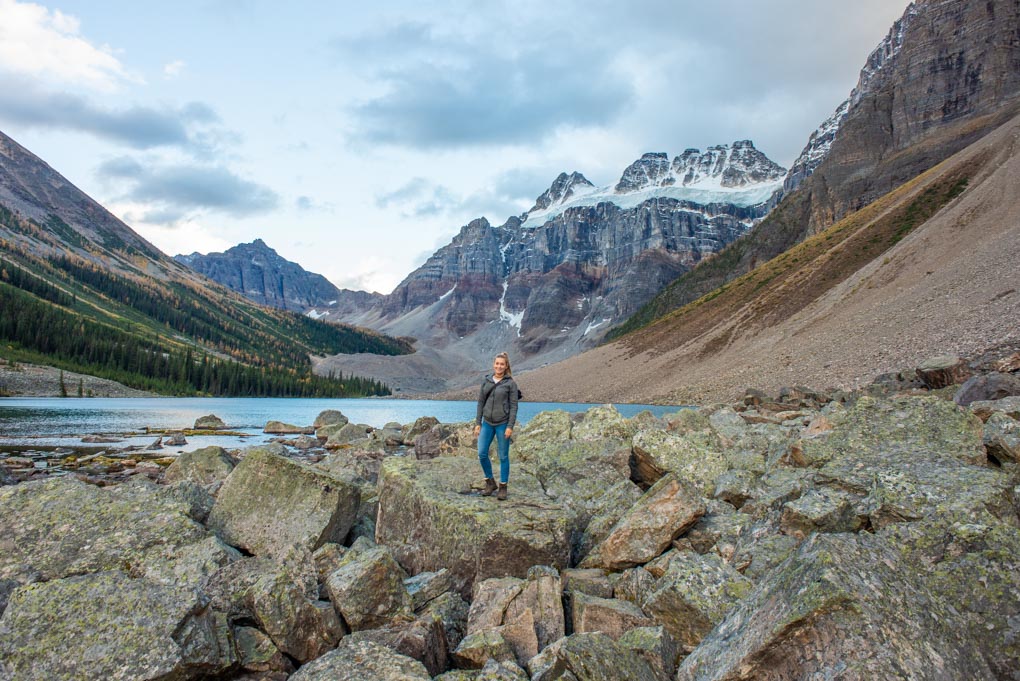 A lady stands on a rock at Consolation Lakes in Banff National Park