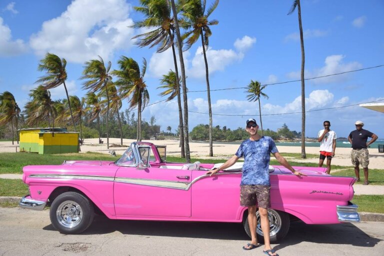 a pink vintage car in havana cuba