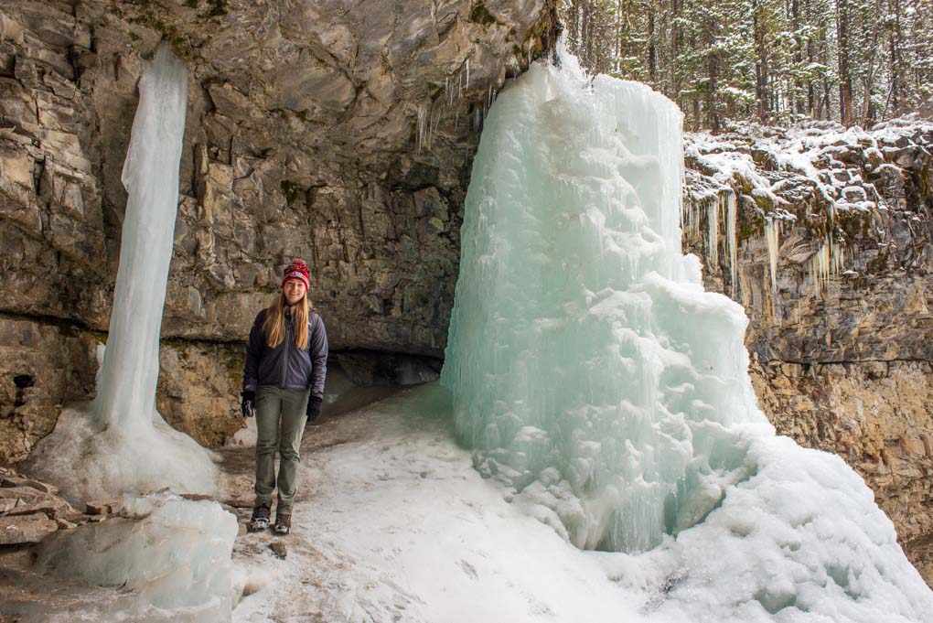 A lady poses for a photo with Troll Falls