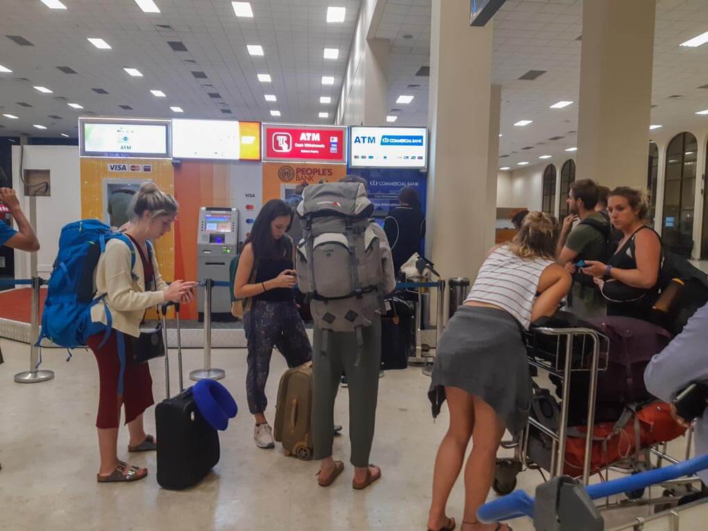 Lining up for an ATM at an airport