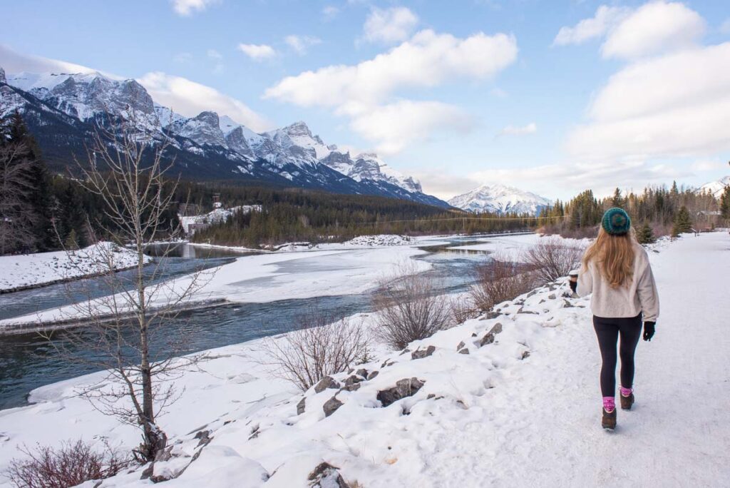 girl walking through Canmore, Alberta in the winter