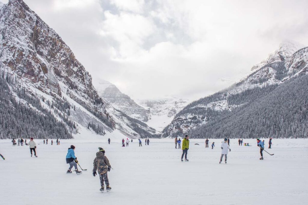 people skating at Lake Louise in the winter