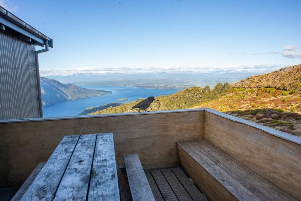 A Kea hangs outside the Luxmore Hut in New Zealand