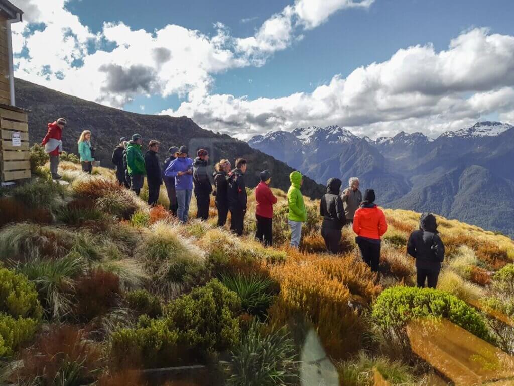 group of people doing a guided walk at Luxmore Hu