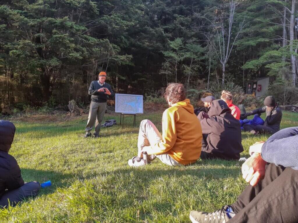 The hut warden giving his daily nature and history speech at Moturau Hut