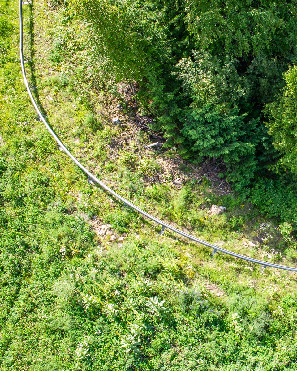 The rail of the Pipe Mountain Coaster in Revelstoke traveling down the mountain