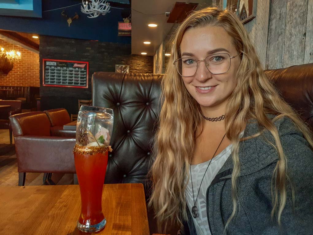 drinking a Caesar at Buckwildz in Sylvan Lake, Alberta