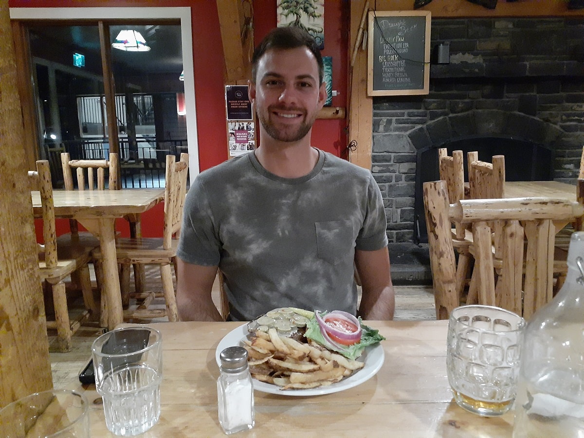 man eating at one of the best restaurants in Lake Louise