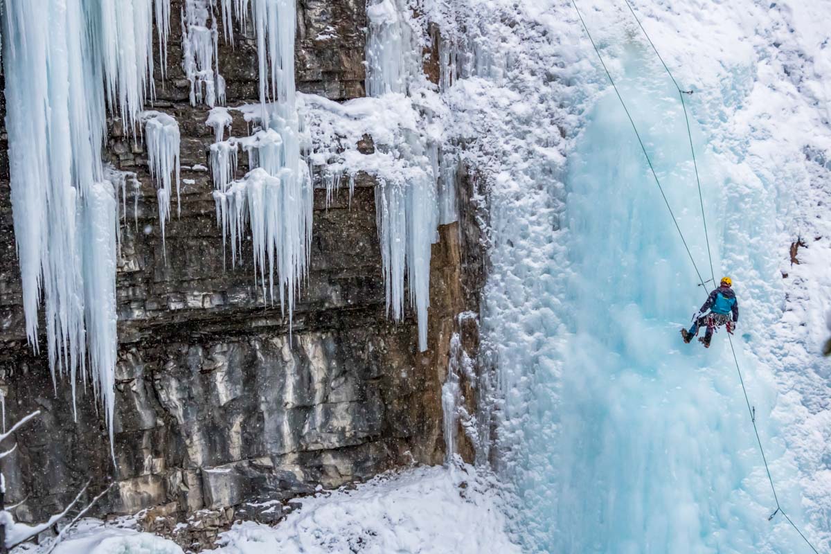 A person Ice Climbs in Johnston Canyon