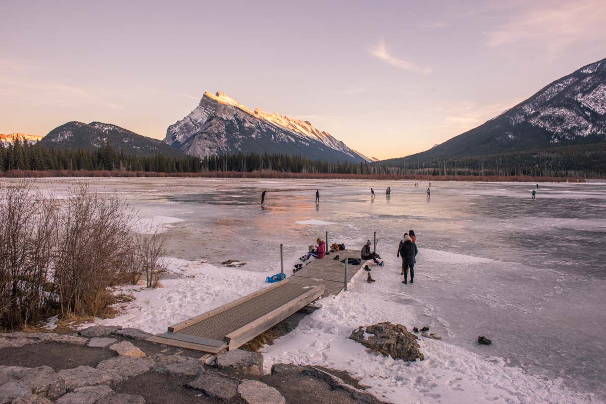 People Ice skating on Vermillion Lakes near Banff