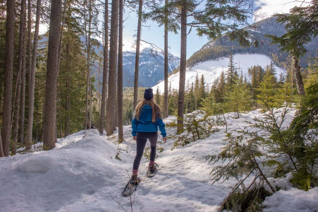 Snowshoeing through the Canadian forest in British Columbia