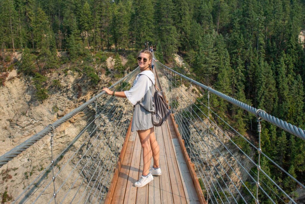 Vailey from Destinationless Travel walks along the Golden Sky Bridge