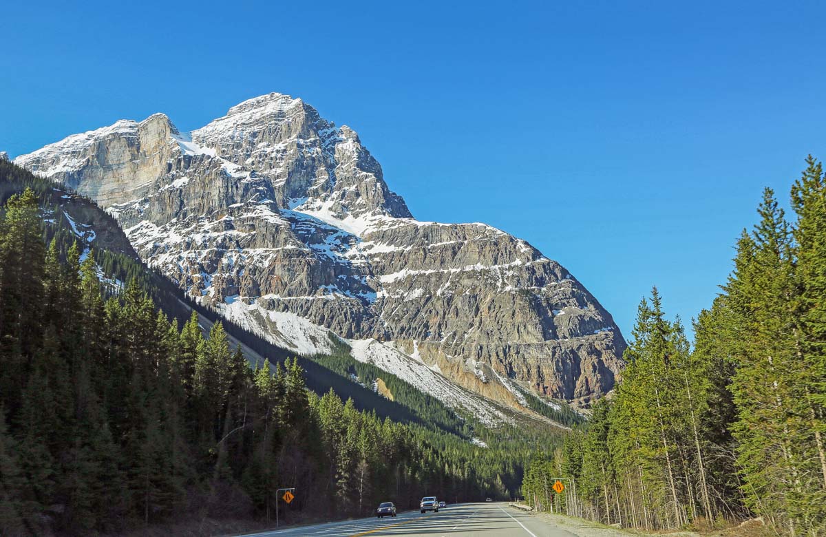 A road with mountain views in Yoho National Park