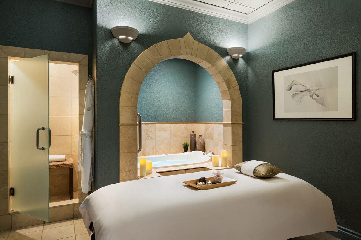 A massage table in a beautifully decorated and relaxing room at the Fairmont Spa in Lake Louise