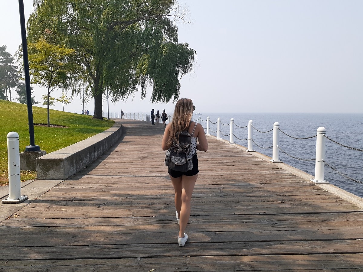 woman walking the boardwalk in Kelowna, BC