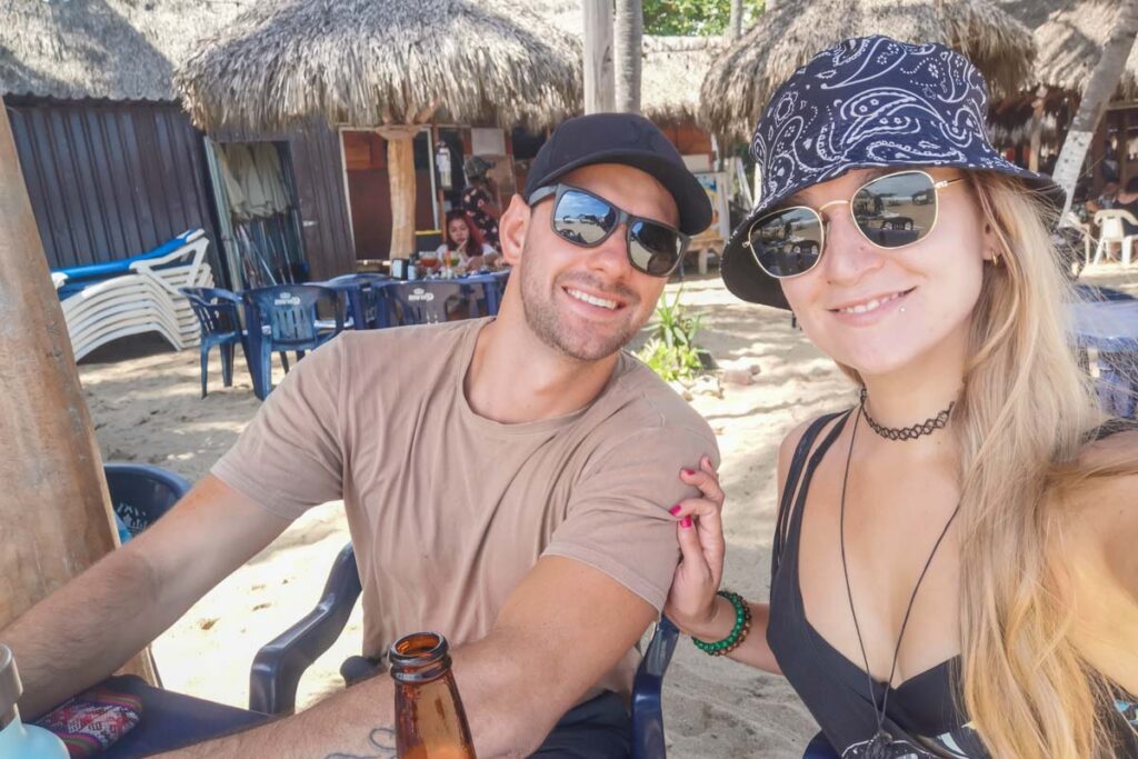 Dan and Bailey from Destinationless Travel take a selfie on San Pancho Beach, Mexico