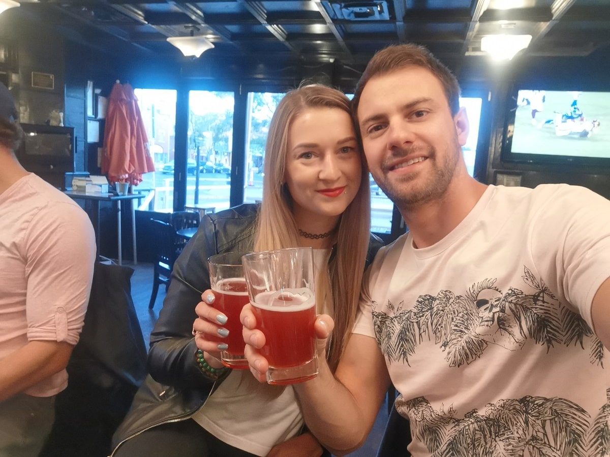 Bailey and Daniel drinking beer at a popular pub in Edmonton