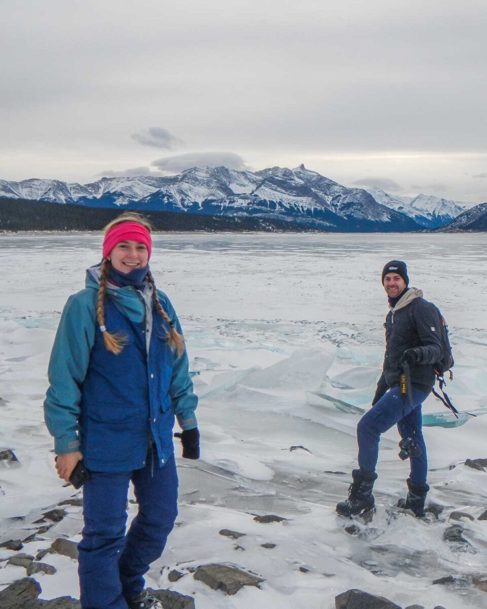 Dan and Bailey walk on the frozen Abraham Lake near Nordegg, Alberta