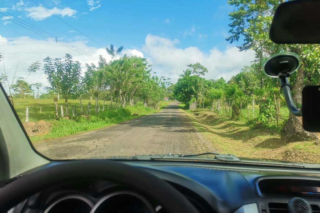 Driving a rental car on a road through Costa Rica