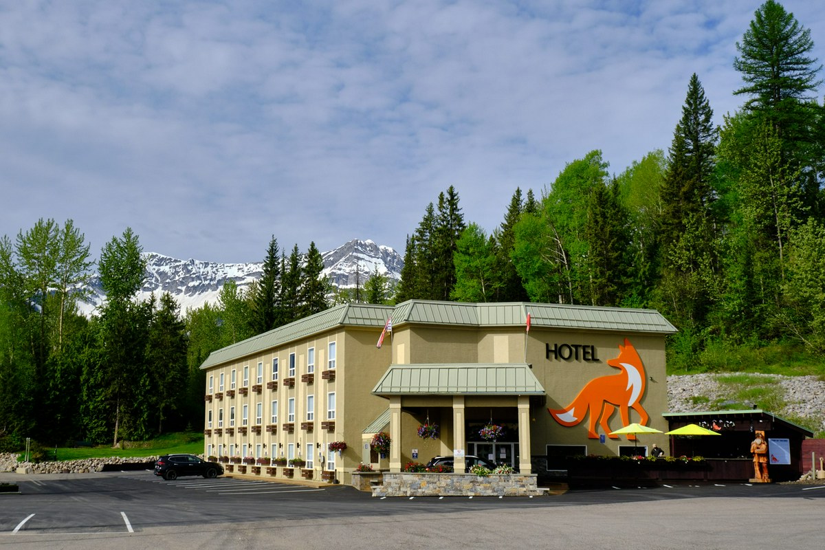 Outside of Fernie Fox Hotel with snowcapped mountains in the background