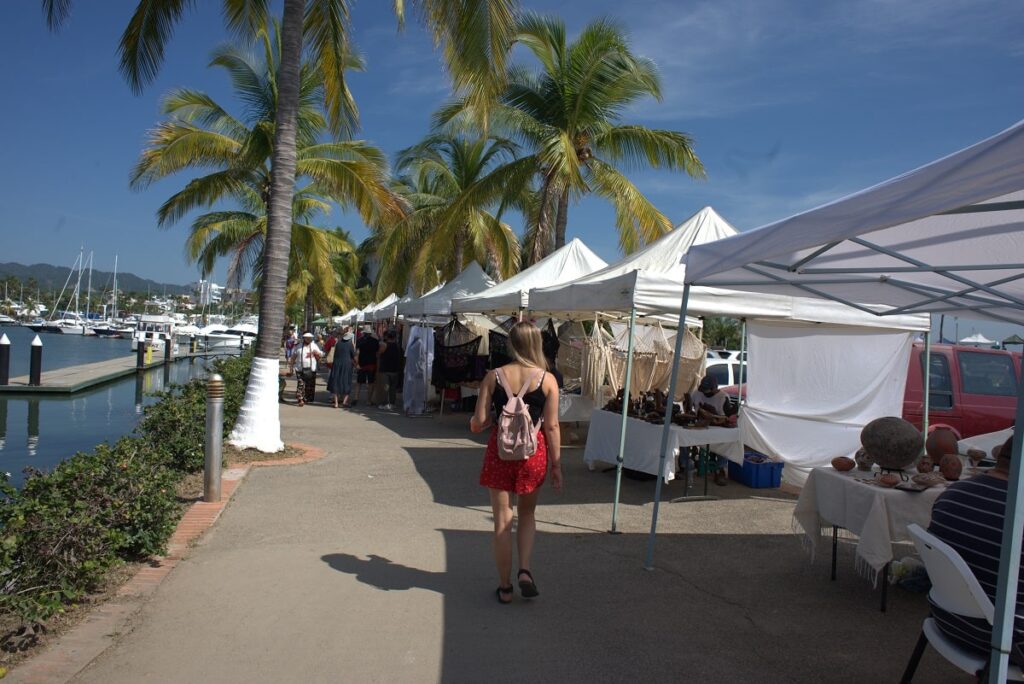 woman walks around the Santa Cruz Market