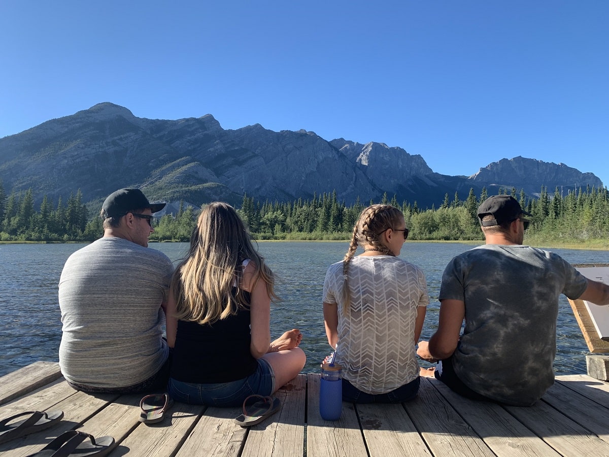 group of people sitting on the dock at Many Springs
