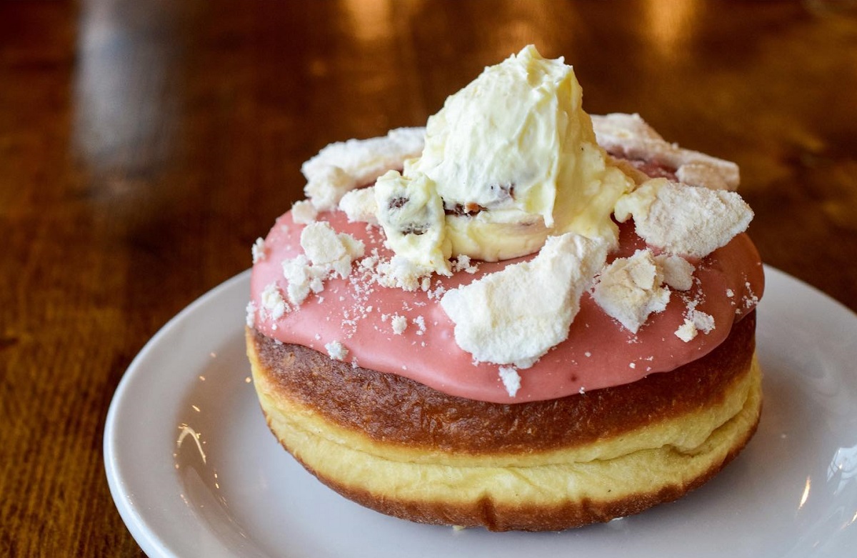a strawberry donut with whipped cream from Bigfoot Donuts