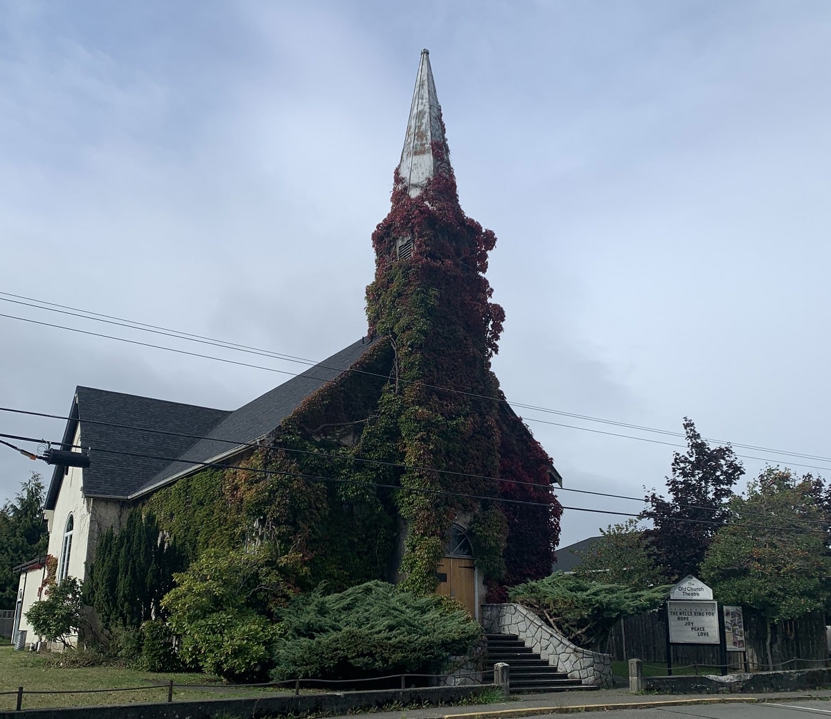 The outside of the Theatre Church in downtown Courtenay, covered in vines