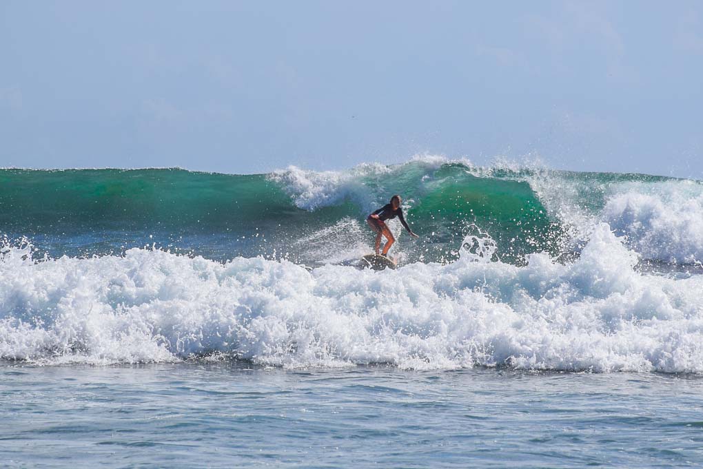 Bailey surfs in Tulum Mexico