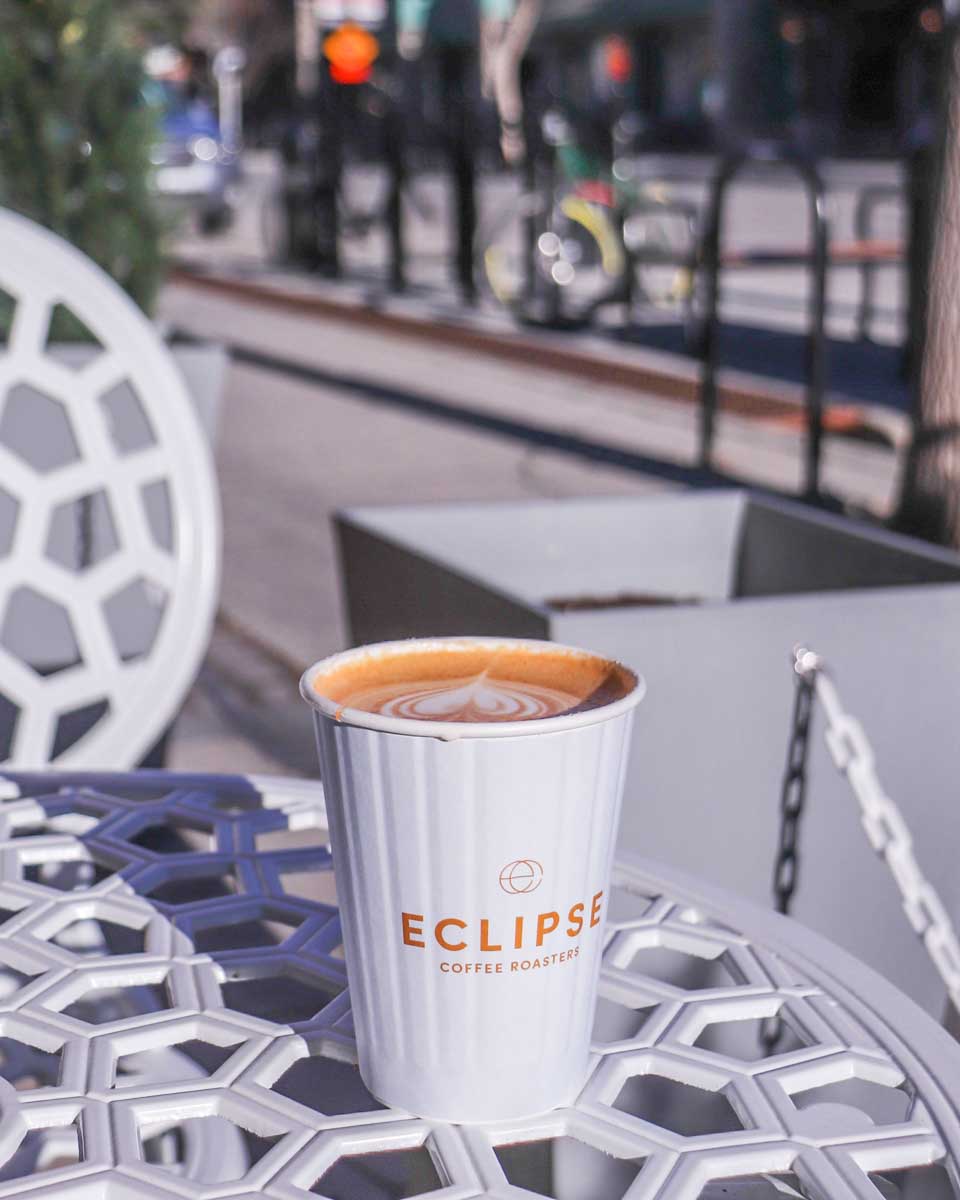 Eclipse Coffee Roasters patio with a fresh coffee