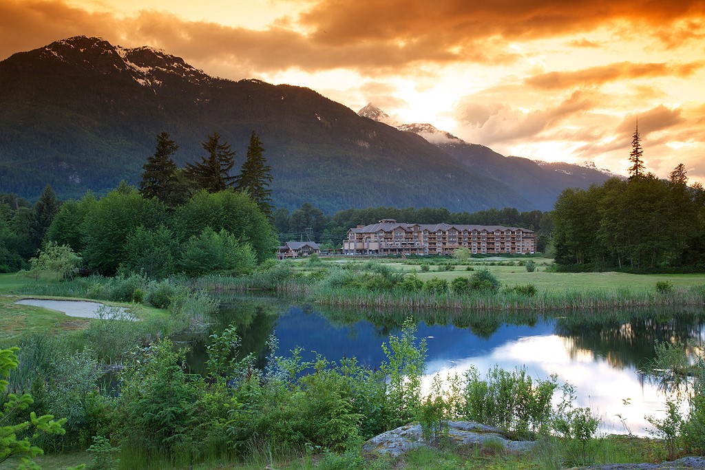 the outside of Executive Suites Hotel & Resort, Squamish BC at sunset