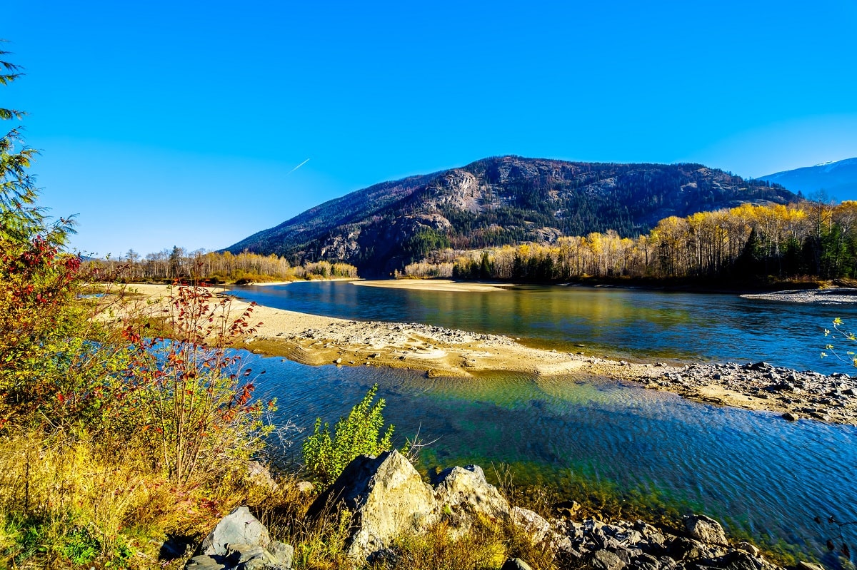 the North Thompson River on a blue bird day with a mountain backdrop