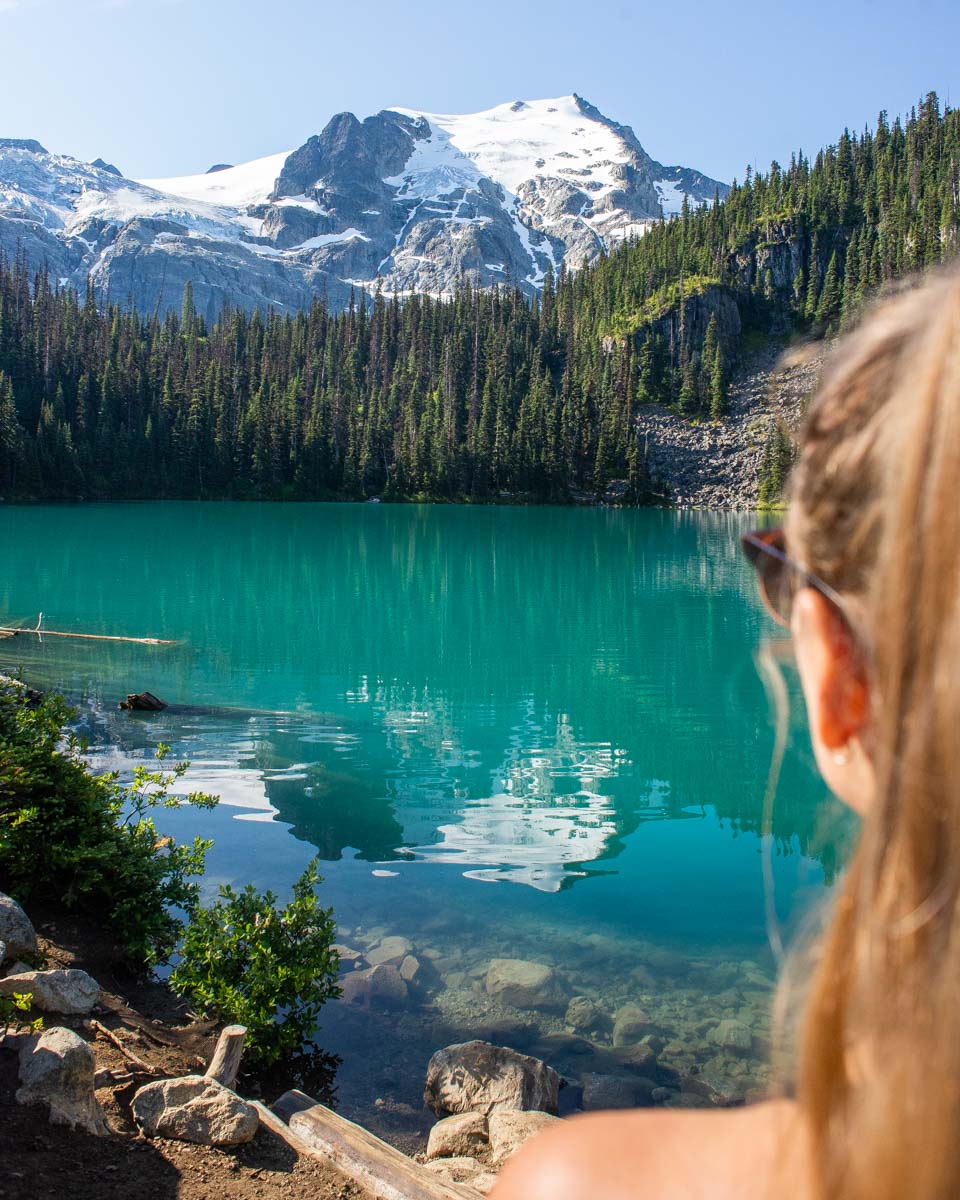 A person enjoys the view of Middle Joffre Lake