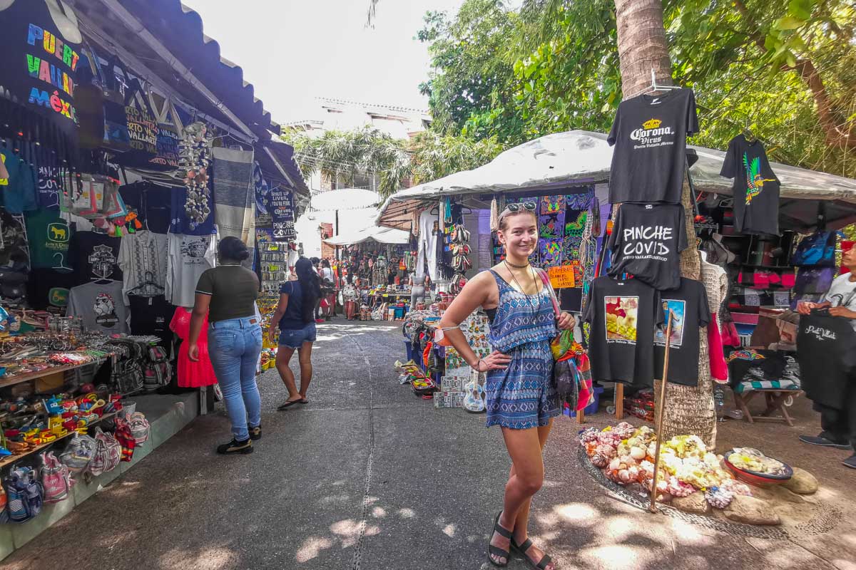 A lady poses for a photo while Shopping at Mercado Municipal Rio Cuale in Puerto Vallarta