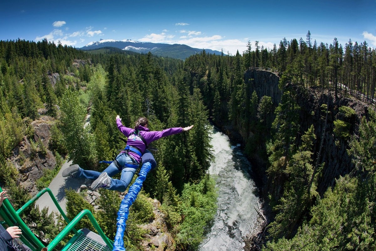 woman jumping at Whistler Bungee in the summer