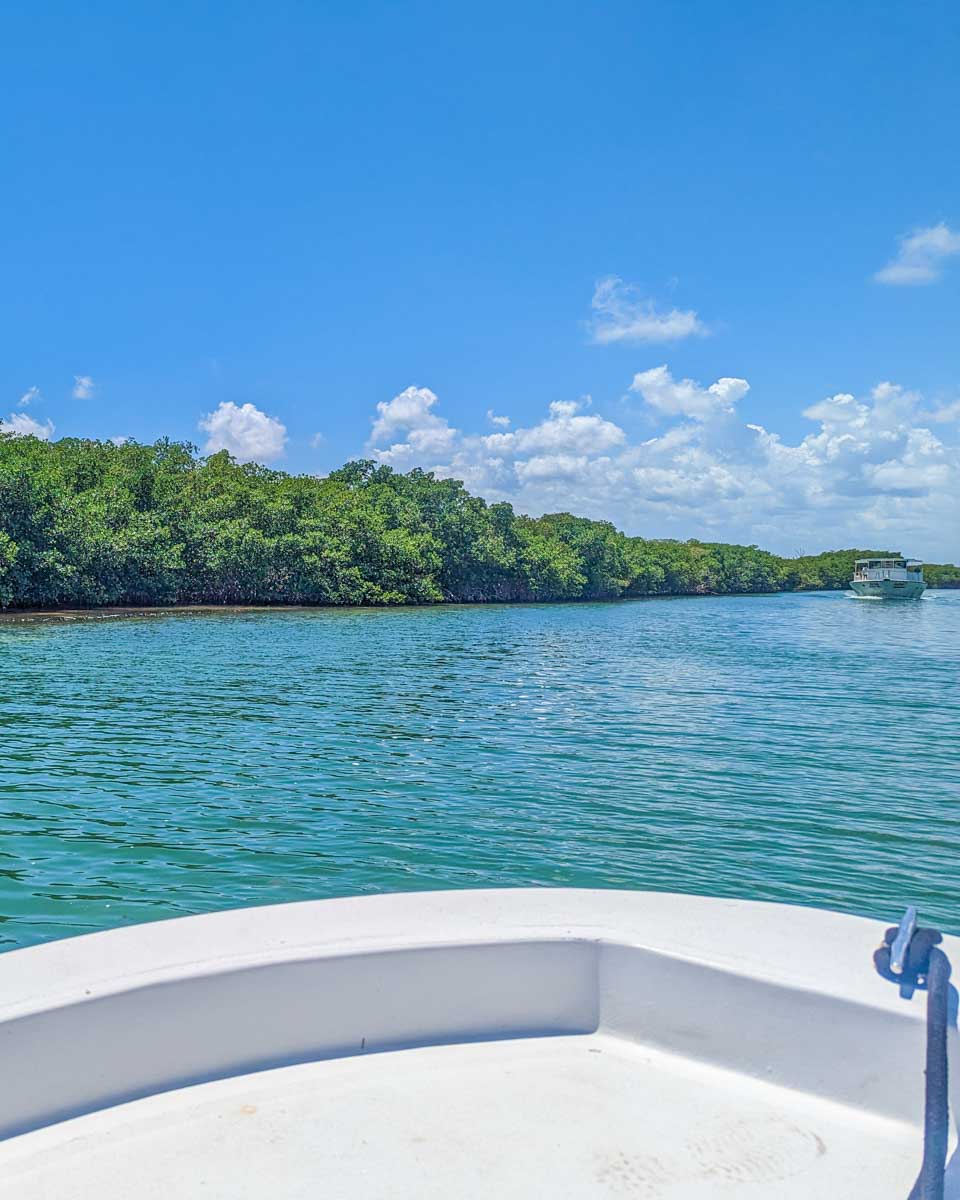A boat cruises through Nichupte Lagoon in Cancun, Mexico