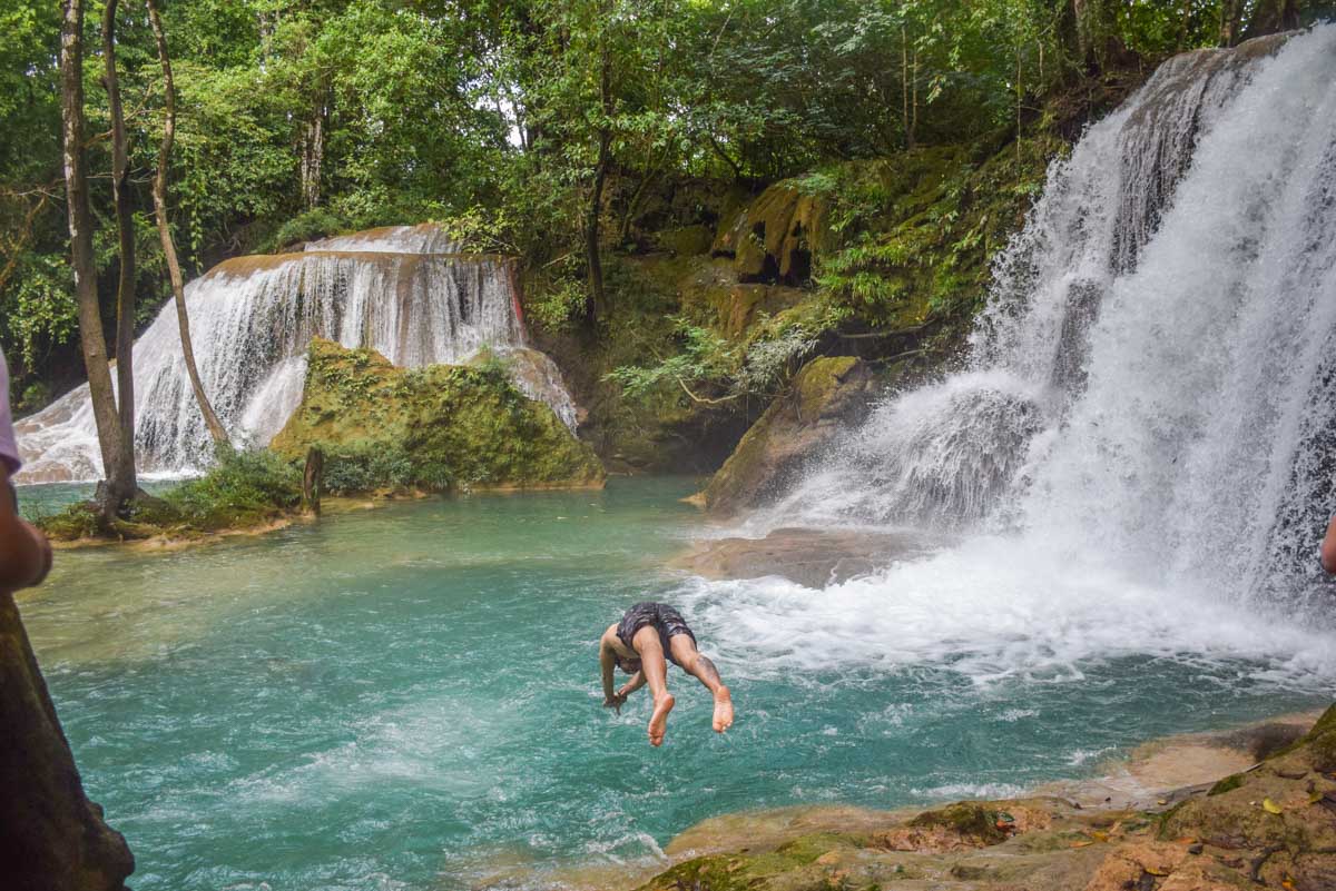 A man dives into Roberto Barrios Waterfall in Chiapas, Mexico