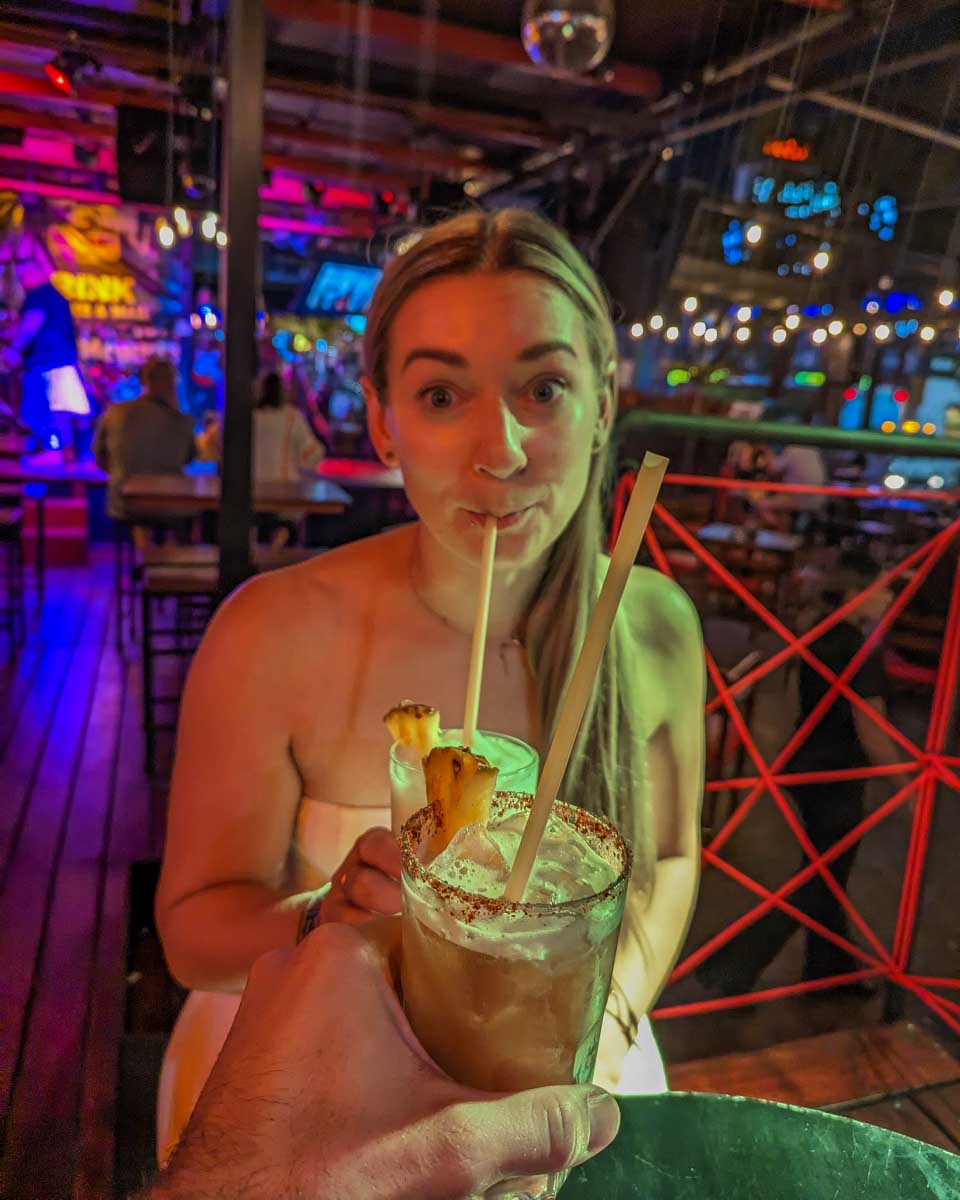 Bailey drinks a cocktail at Monkey Buisness in Cancun, Mexico