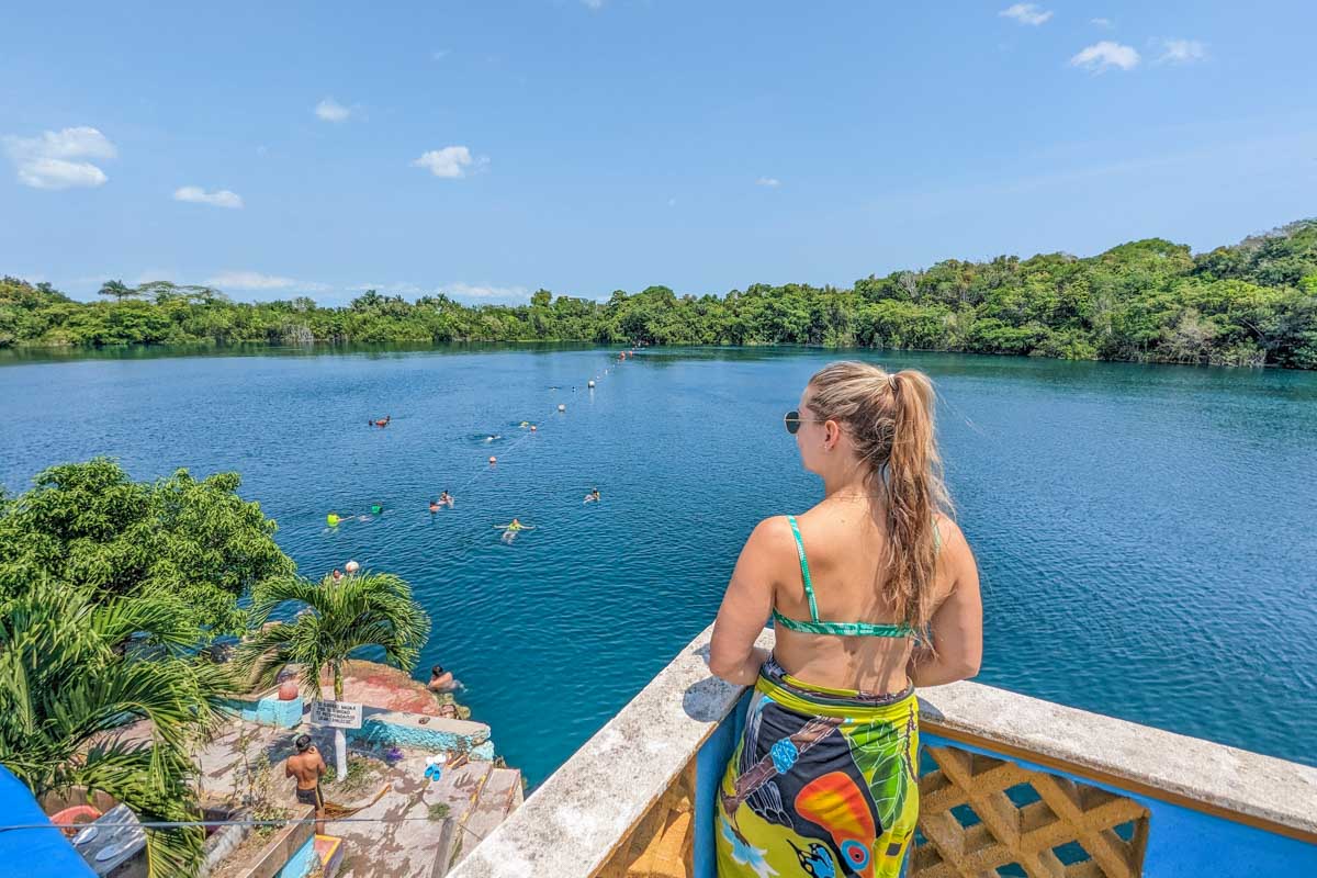 Bailey overlooks Cenote Azul in Bacalar, Mexico