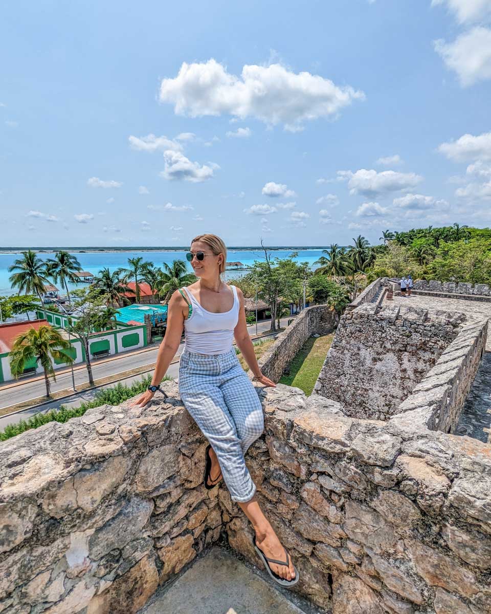 Bailey sits on the wall of Fort San Felipe in Bacalar, Mexico