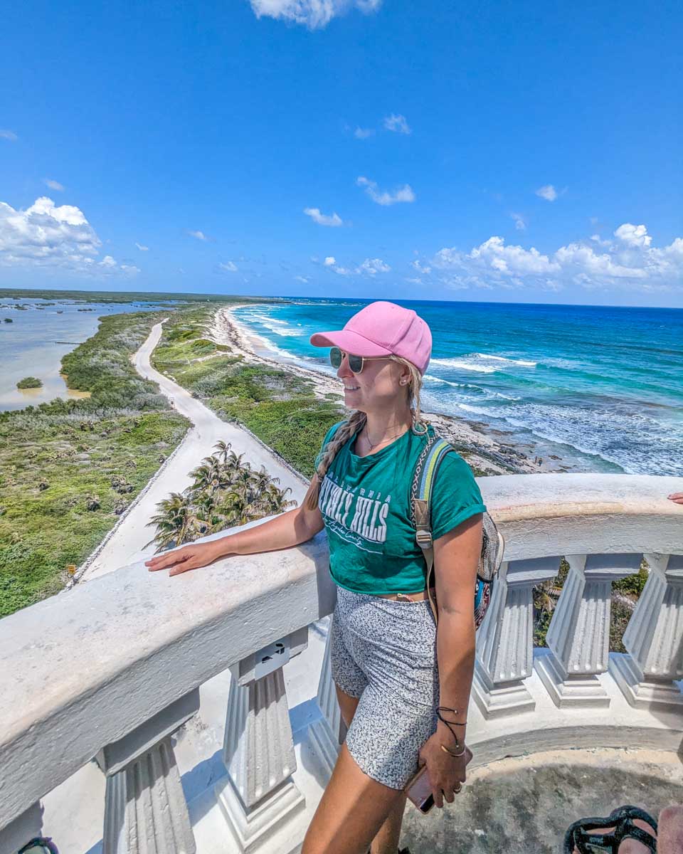 Bailey stands at the top of Faro de Punta Celarayn Lighthouse on Cozumel, Mexico