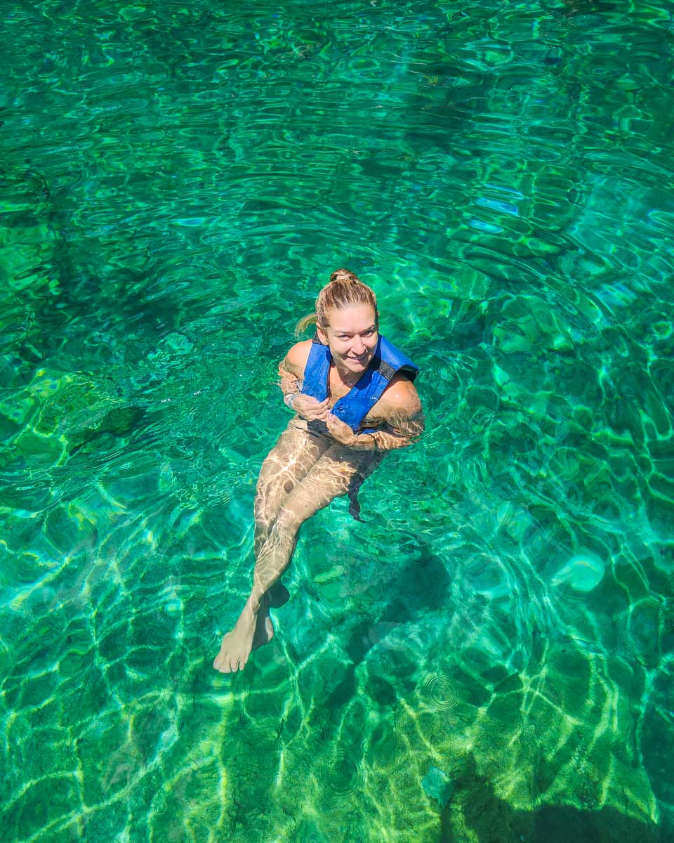 Bailey swims in a cenote near Cancun, Mexico