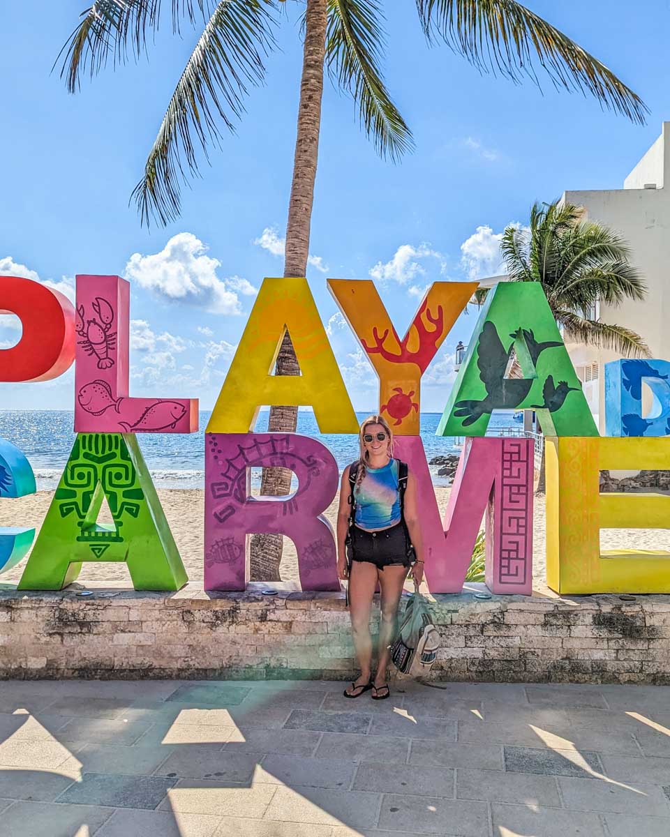 Bailey with the Playa del Carmen sign in Playa del Carmen, Mexico